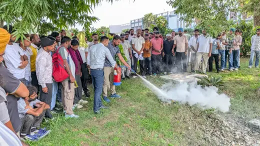 Live fire extinguisher demonstration during an on-site mock drill — Zed-King Institute of Fire And Safety gallery