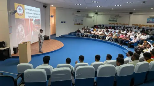 Fire safety awareness session led by a Zed-King trainer in a full auditorium — Zed-King Institute of Fire And Safety gallery